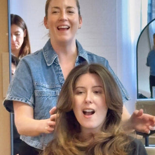 Kristen Patterson, owner,  smiling with a client at Private Studio in Toronto.