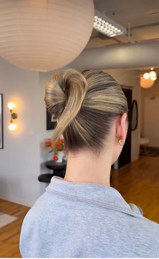 Chic, minimal updo by Rachelle Cruz at Private Studio in Toronto.