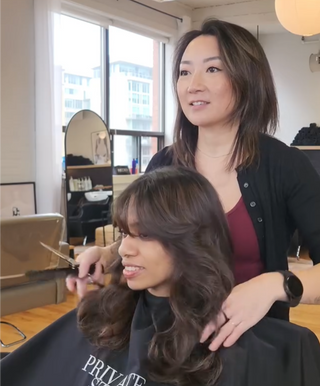 Private Studio Hairstylists, Cindy Li performing a layered haircut one a client at her station