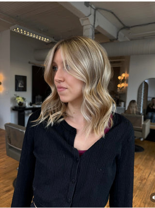 A Private Studio client showing off her fresh haircut and dimensional, lived-in blonde hair colour.