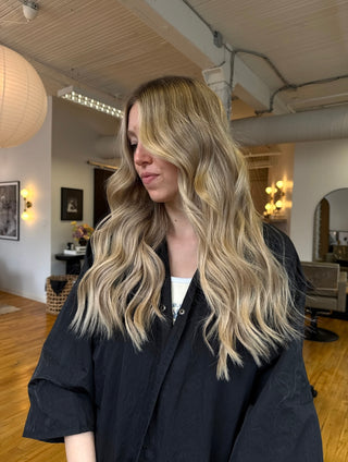 A Private Studio client showing off her fresh haircut and dimensional, lived-in blonde hair colour.