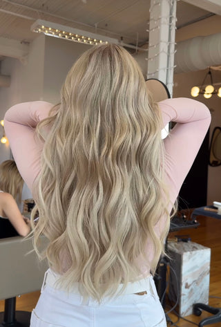 A Private Studio client showing off her fresh haircut and dimensional blonde hair colour.