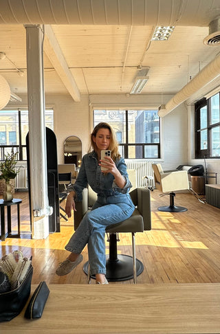 Kristen Patterson founder of Private Studio sitting in her salon station