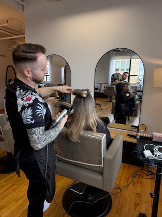 Richie Araish round brushing a client's hair using an Ibiza Brush at Private Studio in Toronto.
