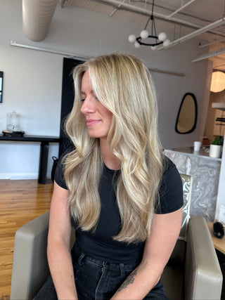 A Private Studio Client with Dimensional Lived-in blonde sitting in the salon styled by Kristen Patterson