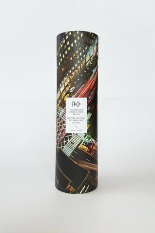 R+Co vegan boar bristle hair brush with wooden handle and natural bristles for smooth, shiny hair grooming.