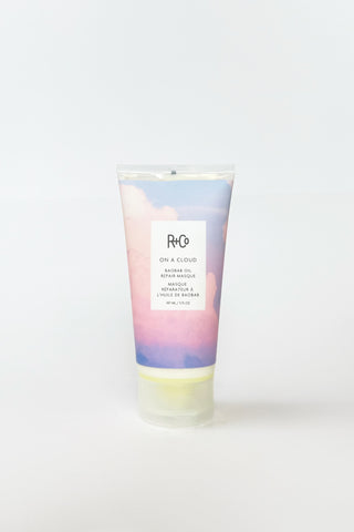 R+Co On a Cloud Repair Masque hair treatment in a sleek jar, showcasing its nourishing and hydrating formula for damaged hair.