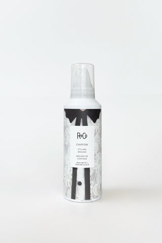 R+Co Chiffon Styling Mousse bottle with pump dispenser, lightweight hair mousse for volume and shine, on a white background.