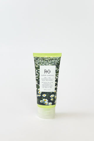 R+Co Super Garden soothing scalp and hair treatment in a sleek bottle, designed to nourish and calm the scalp while conditioning hair.