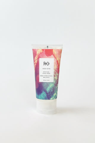 R+Co High Dive Moisture and Shine Crème for hair styling, showing the product container with styling cream on a white background.