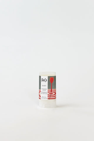 R+Co Dart Pomade Stick for hair styling, showing the sleek black stick with the R+Co logo on the packaging.