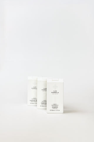 Iles Formula Minis shampoo and conditioner set with small bottles, ideal for travel or trial use.